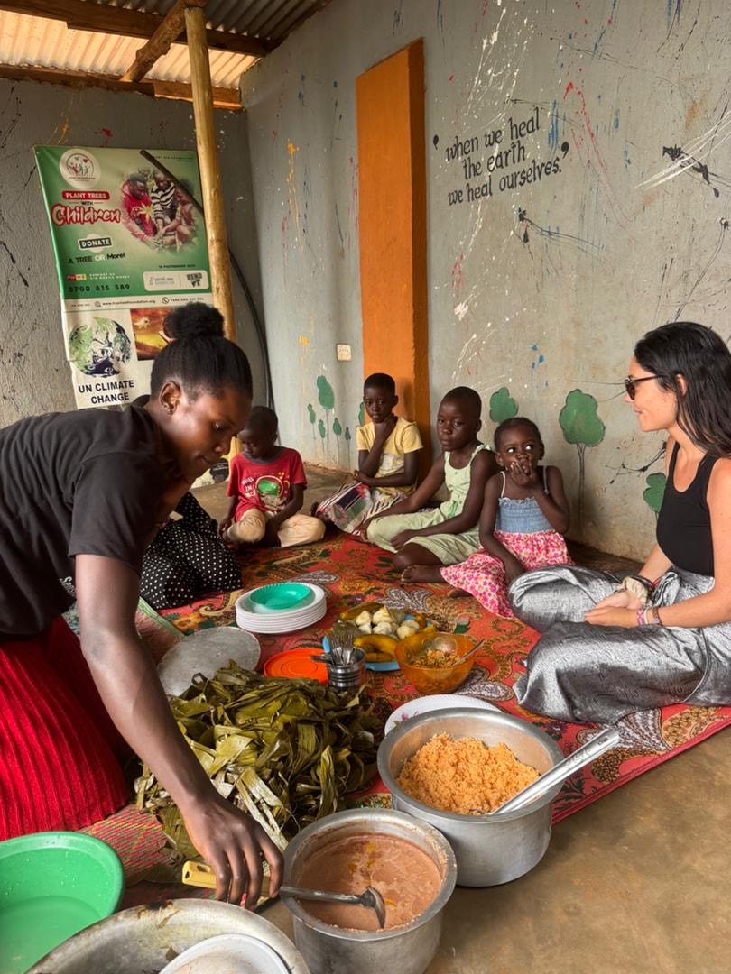 Volunteers preparing a shared meal at Kalule Bwaise Children Shelter