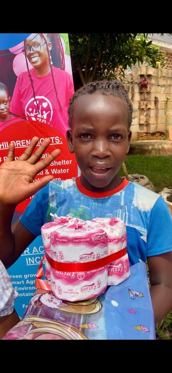 Boy holding a wrapped gift outdoors