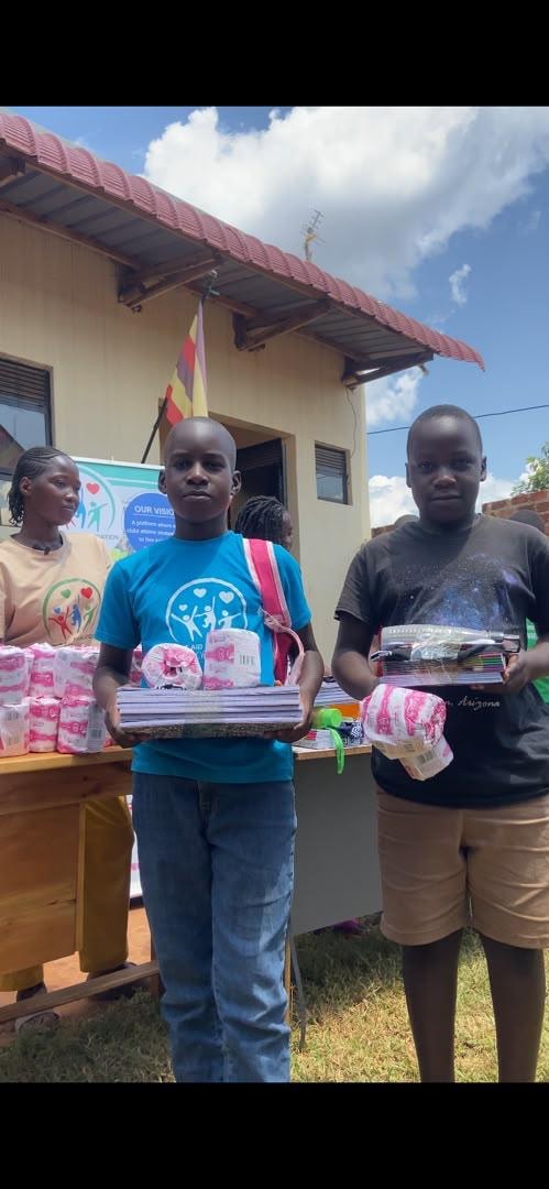 Children holding donated school supplies