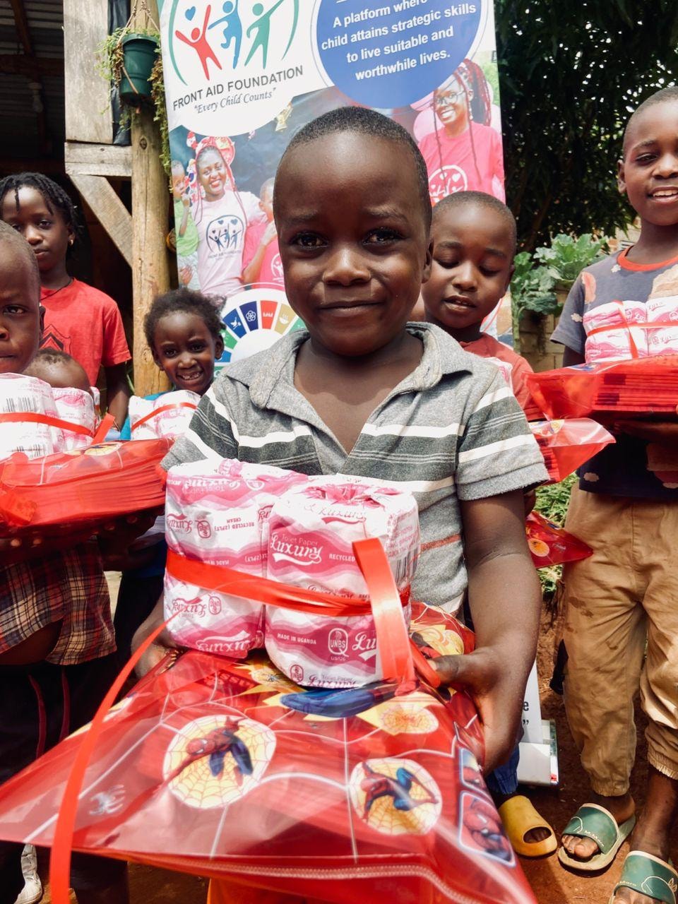 Children holding gift packages together