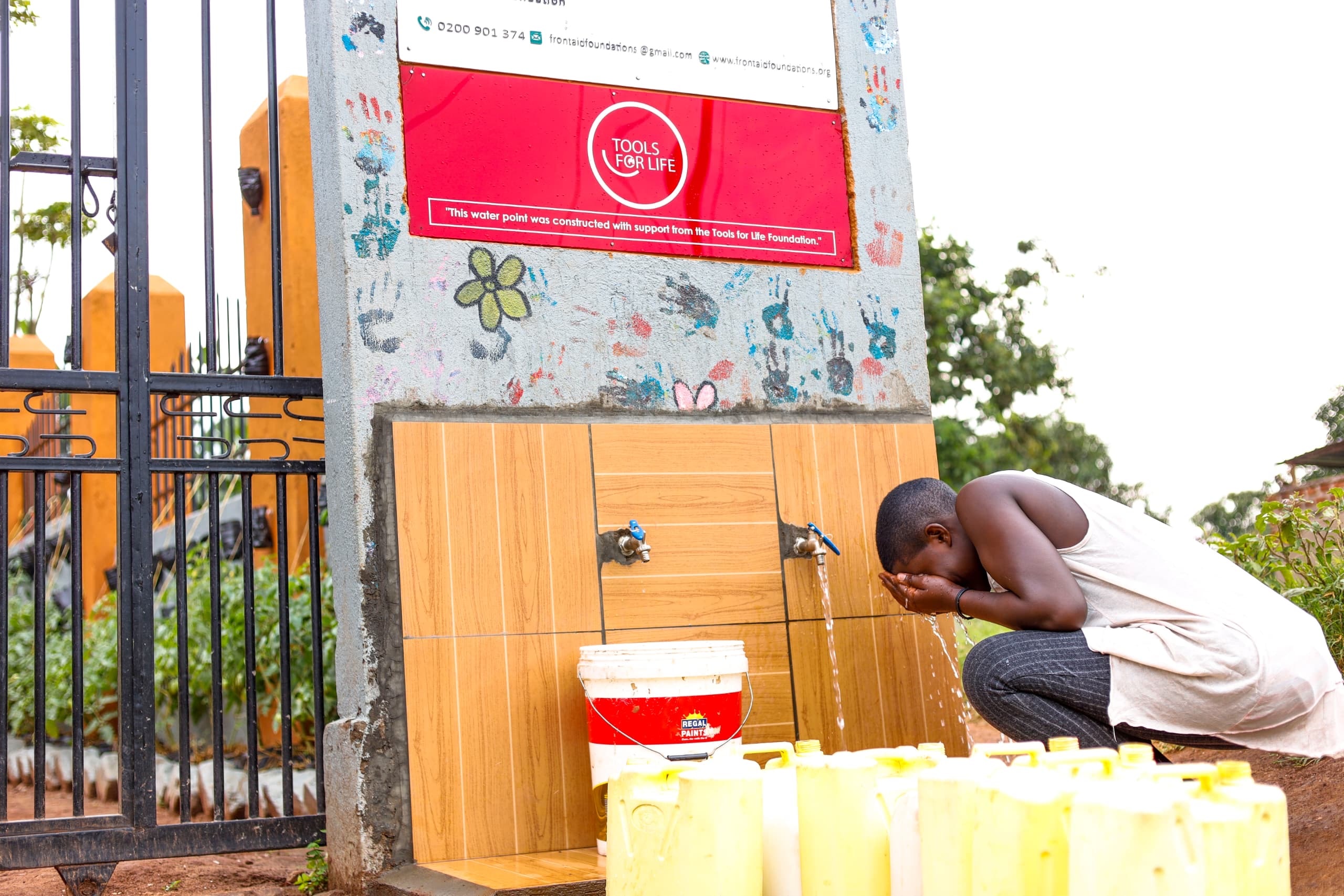 Community members building with bricks in Buwambo